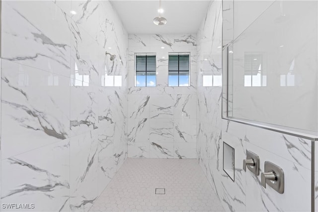 bathroom featuring tiled shower