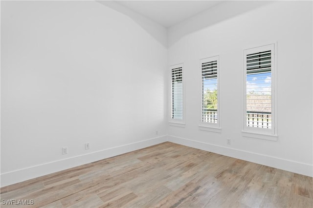 unfurnished room with light hardwood / wood-style flooring