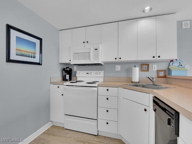 kitchen featuring light hardwood / wood-style floors, white cabinetry, white appliances, and sink