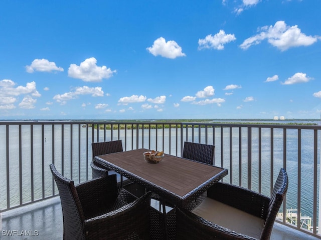 balcony featuring a water view