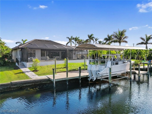 dock area with a lawn, a lanai, and a water view