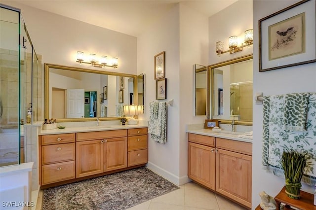 bathroom with tile patterned flooring, vanity, and a shower with shower door