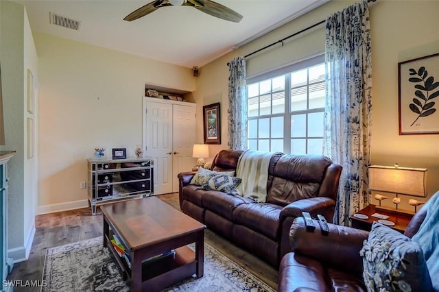 living room with ceiling fan and wood-type flooring