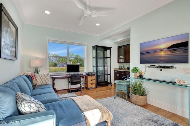 living room with ceiling fan, light hardwood / wood-style floors, and ornamental molding