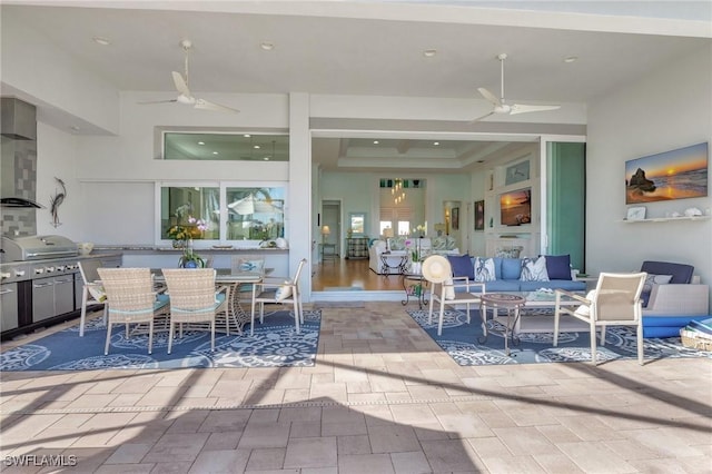 view of patio / terrace with a grill, an outdoor living space, and ceiling fan