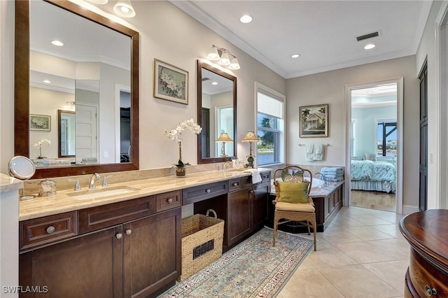 bathroom featuring tile patterned floors, vanity, and crown molding