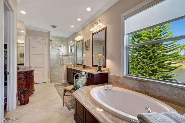 bathroom featuring vanity, tile patterned flooring, plus walk in shower, and ornamental molding