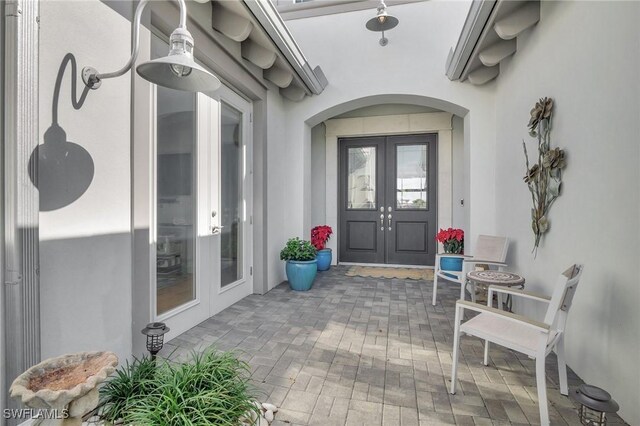 entrance to property featuring french doors