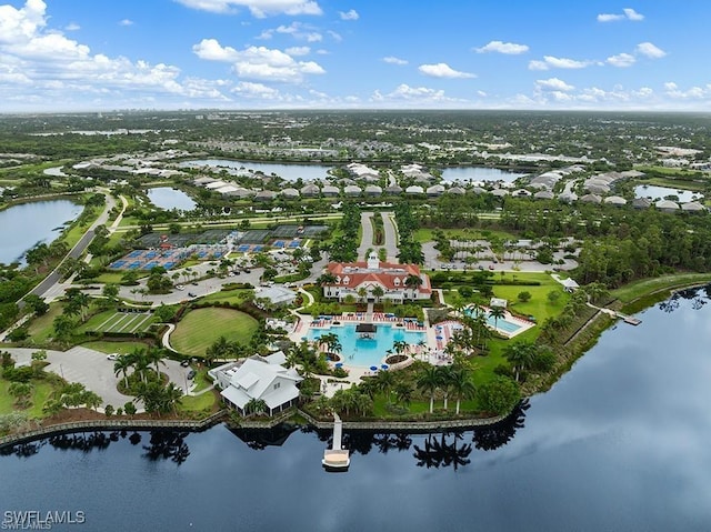 birds eye view of property with a water view