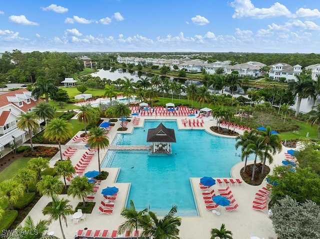 view of swimming pool featuring a water view