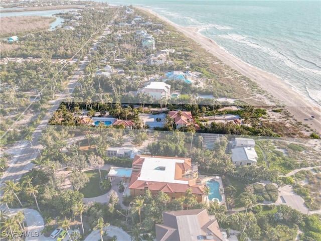 bird's eye view with a water view and a view of the beach