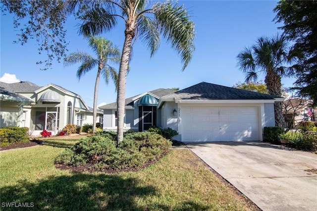 ranch-style home with a front yard and a garage