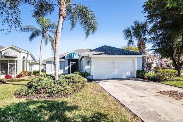 single story home with a garage and a front lawn