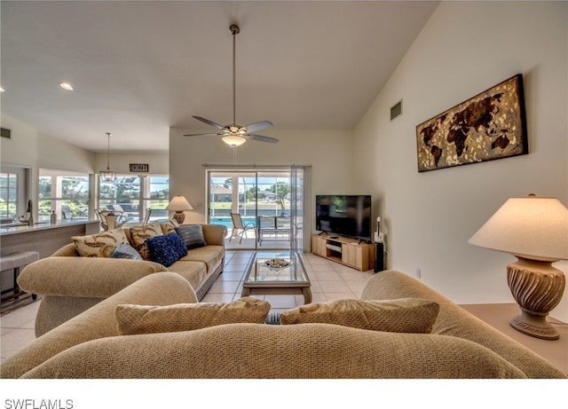 tiled living room with ceiling fan and lofted ceiling