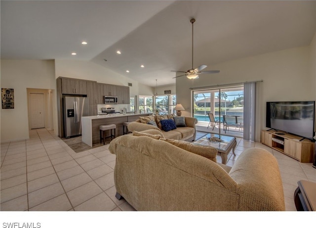 living room featuring light tile patterned floors, high vaulted ceiling, and ceiling fan