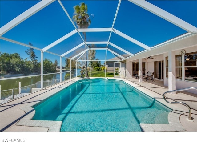 view of swimming pool with a water view, a patio area, ceiling fan, and a lanai