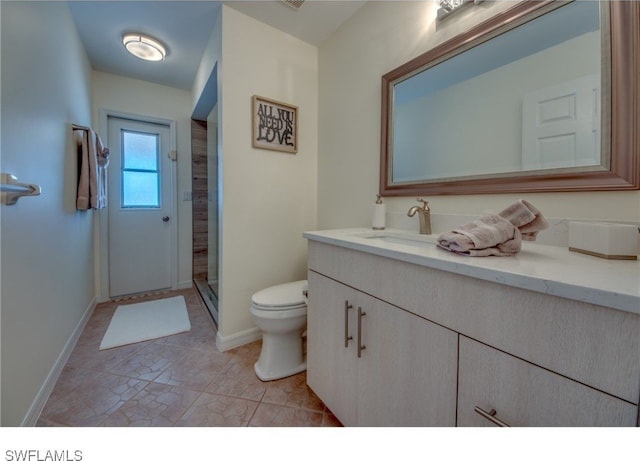 bathroom with vanity, an enclosed shower, and toilet