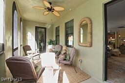 exterior space with ceiling fan