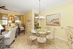 dining space featuring ceiling fan and crown molding