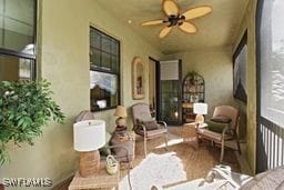 exterior space with ceiling fan