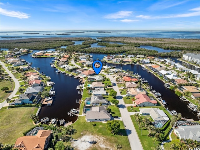 birds eye view of property featuring a water view