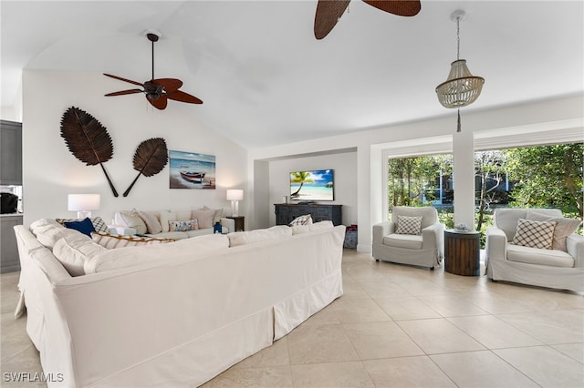 tiled living room with ceiling fan and vaulted ceiling