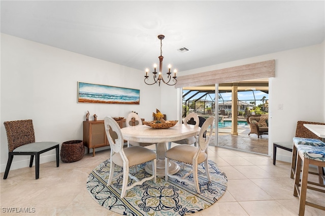 tiled dining room with a notable chandelier