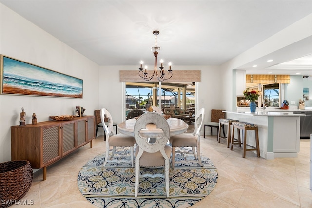 dining room with a notable chandelier