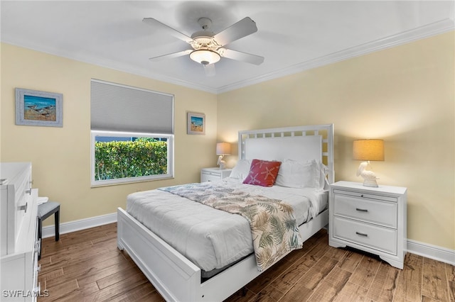 bedroom with ceiling fan, dark hardwood / wood-style flooring, and crown molding