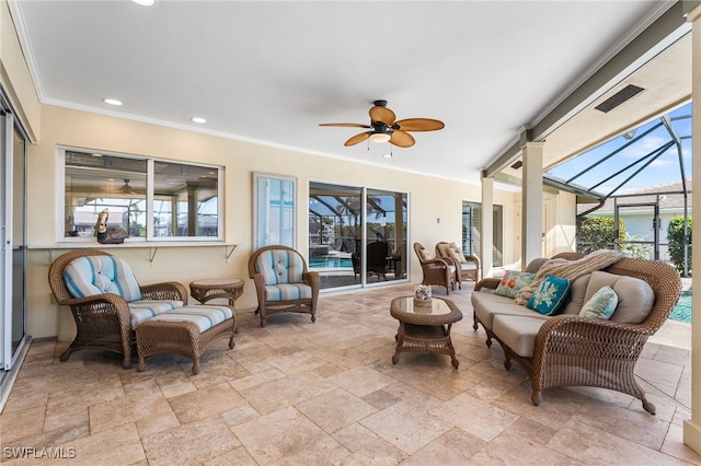 sunroom featuring ceiling fan