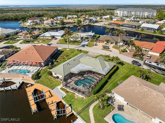 birds eye view of property with a water view