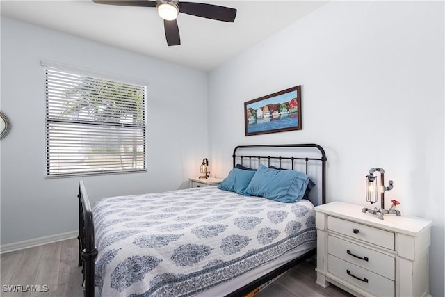 bedroom featuring wood-type flooring and ceiling fan