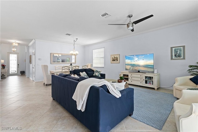 living room featuring tile patterned flooring, crown molding, and ceiling fan with notable chandelier