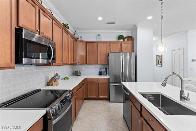 kitchen with sink, ornamental molding, appliances with stainless steel finishes, pendant lighting, and decorative backsplash