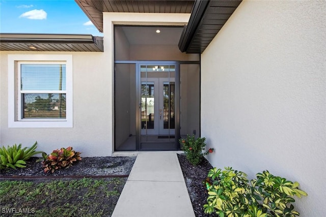 property entrance featuring french doors