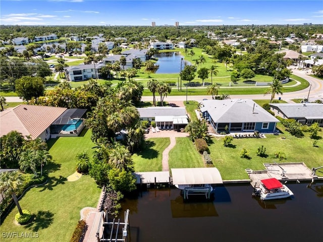 birds eye view of property featuring a water view