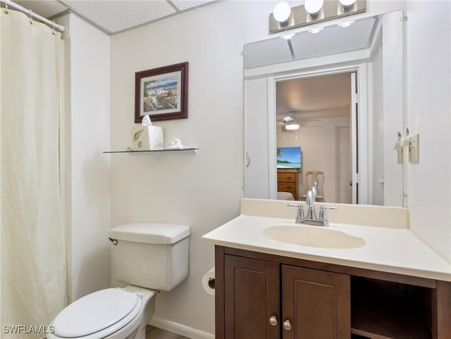 bathroom featuring vanity, toilet, and ceiling fan