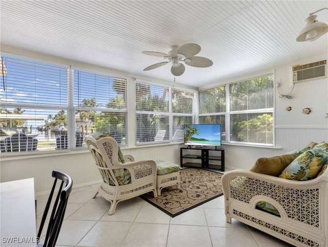 sunroom featuring ceiling fan and a wall mounted AC