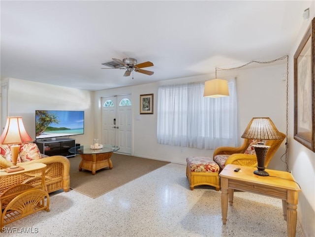 living room featuring ceiling fan