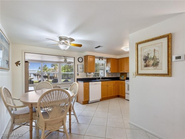 kitchen with ceiling fan, sink, light tile patterned flooring, and white appliances