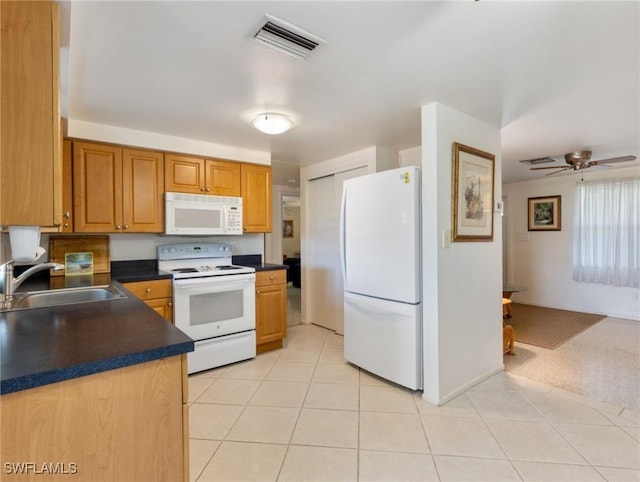 kitchen with light tile patterned floors, white appliances, ceiling fan, and sink