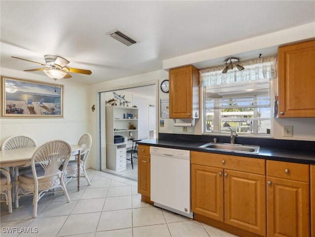 kitchen with dishwasher, ceiling fan, light tile patterned floors, and sink