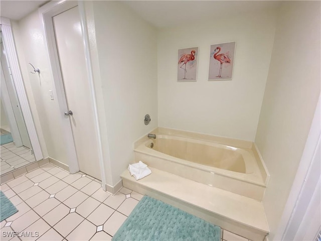 bathroom featuring tile patterned floors and a bathing tub