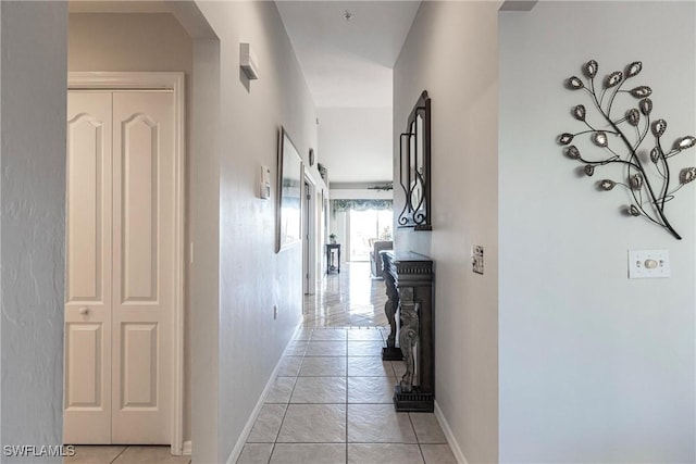 corridor featuring light tile patterned flooring