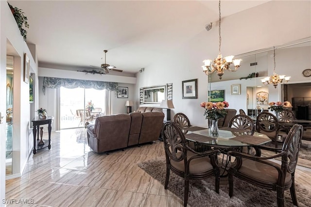 dining area featuring ceiling fan and lofted ceiling