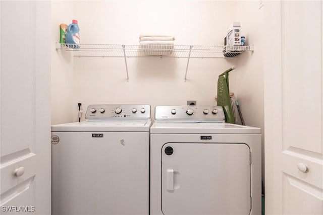 laundry area with washer and clothes dryer