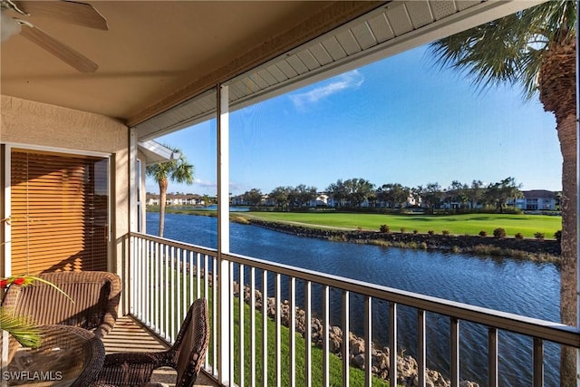 exterior space with a water view and ceiling fan