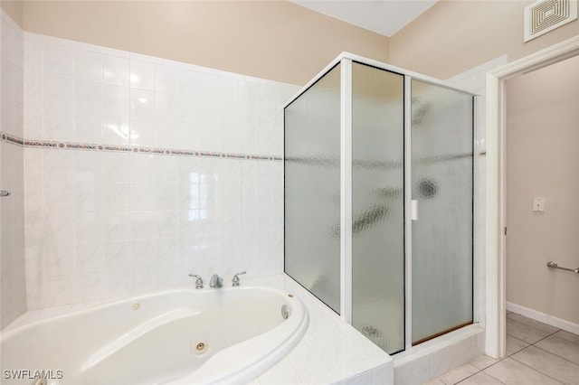 bathroom featuring plus walk in shower and tile patterned floors