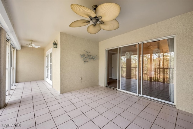 view of patio / terrace featuring ceiling fan and french doors