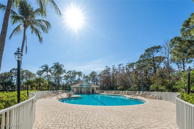 view of swimming pool featuring a patio area